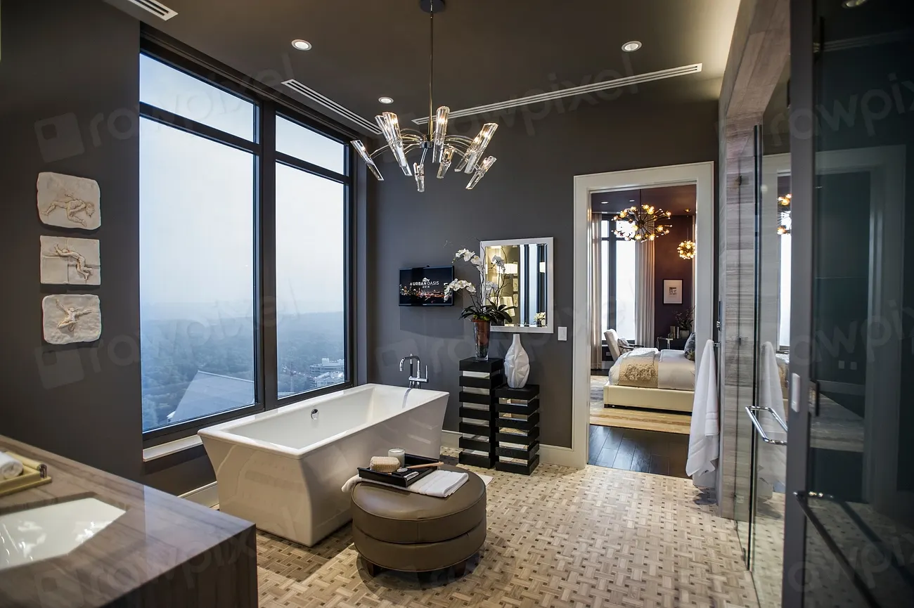 A large primary bathroom with a freestanding tub and walk-in shower