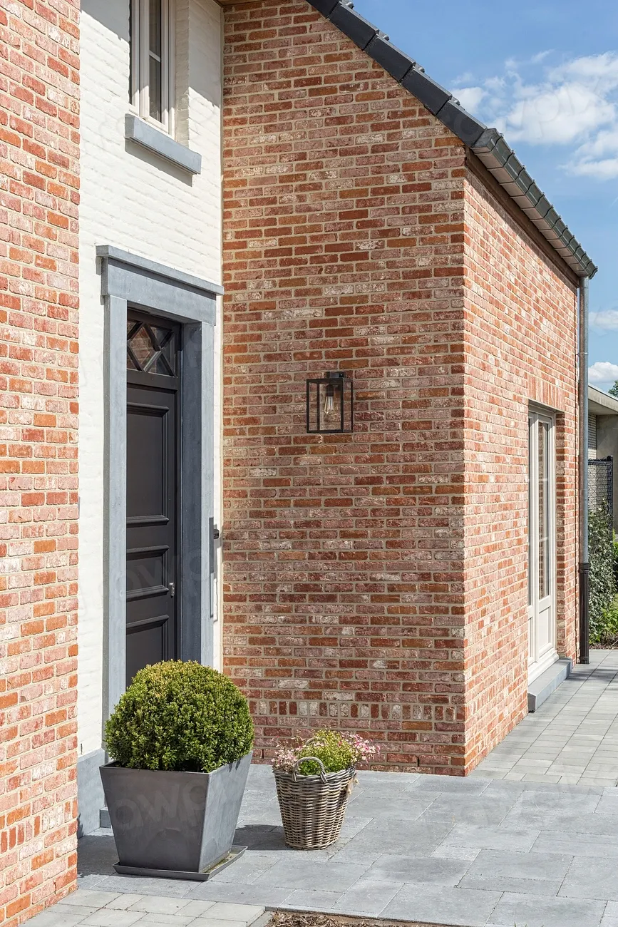 The brick front of a house we repiped